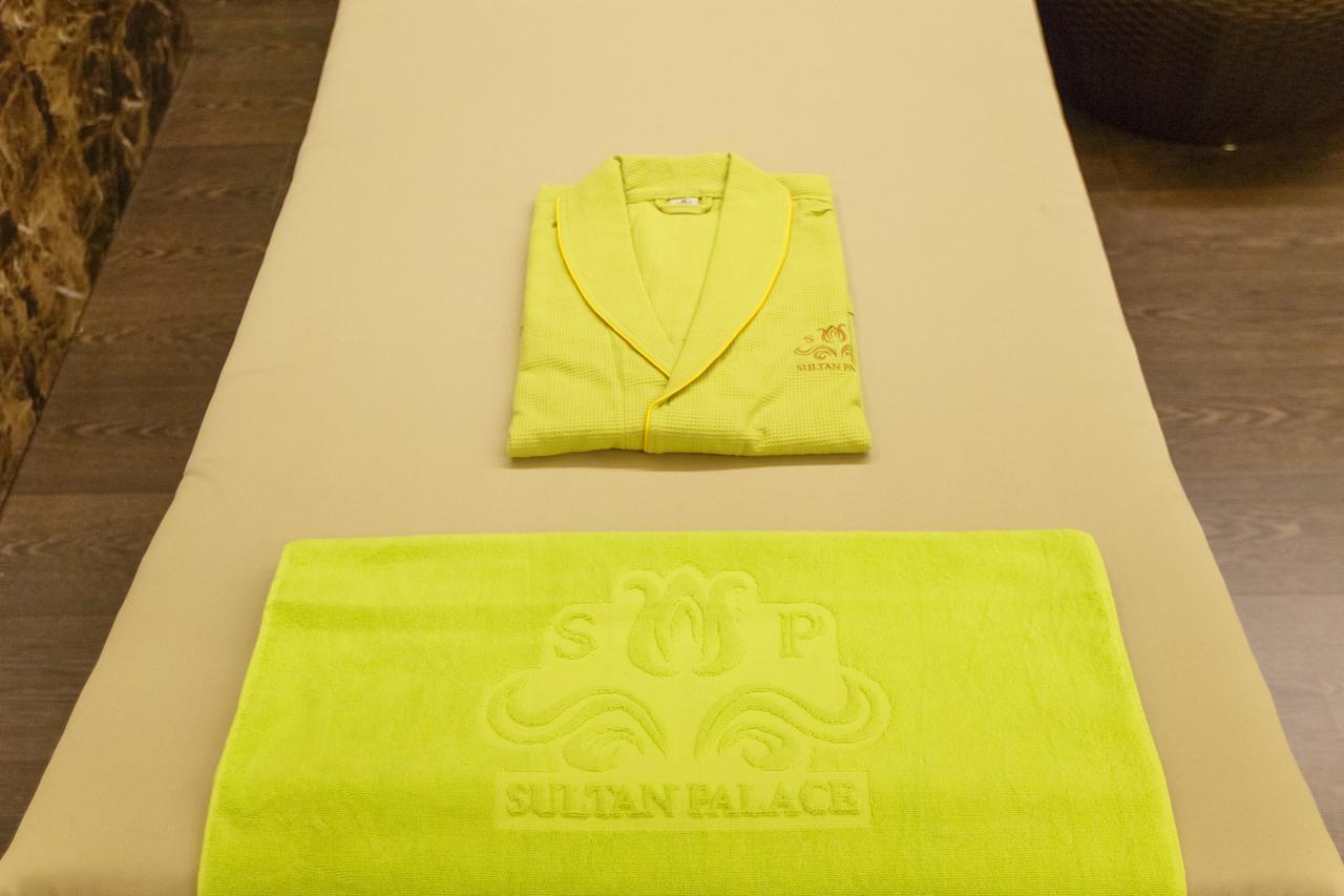 Sultan Palace Hotel Atyrau Exterior photo A bathrobe and towel